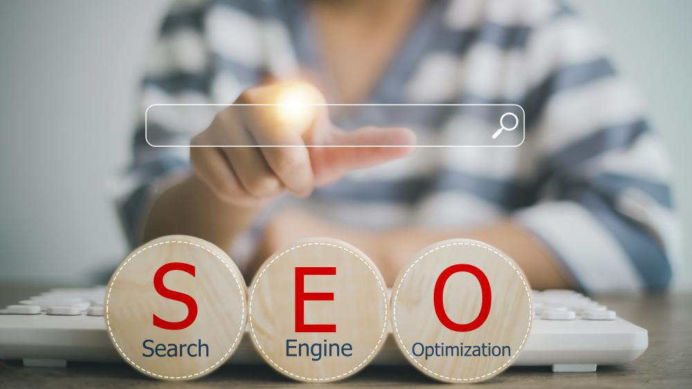 SEO Services in Winchester - Concept Search engine optimization concept with magnifying glass and gears